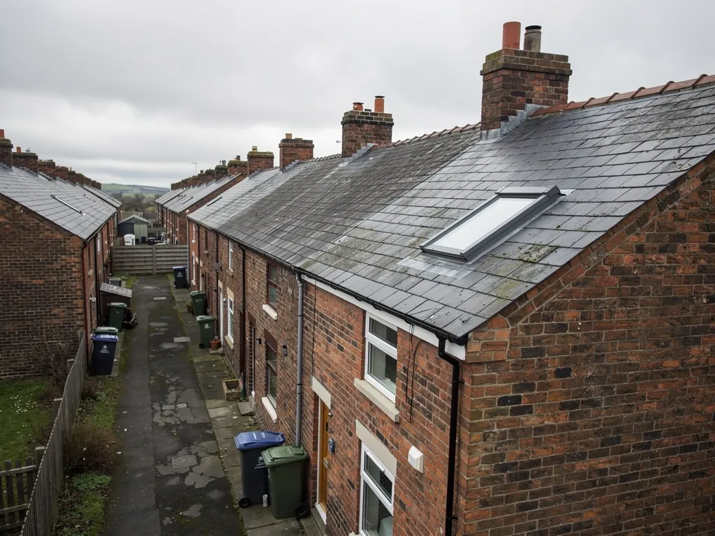 Back lane with bins between brick terraces seen from above