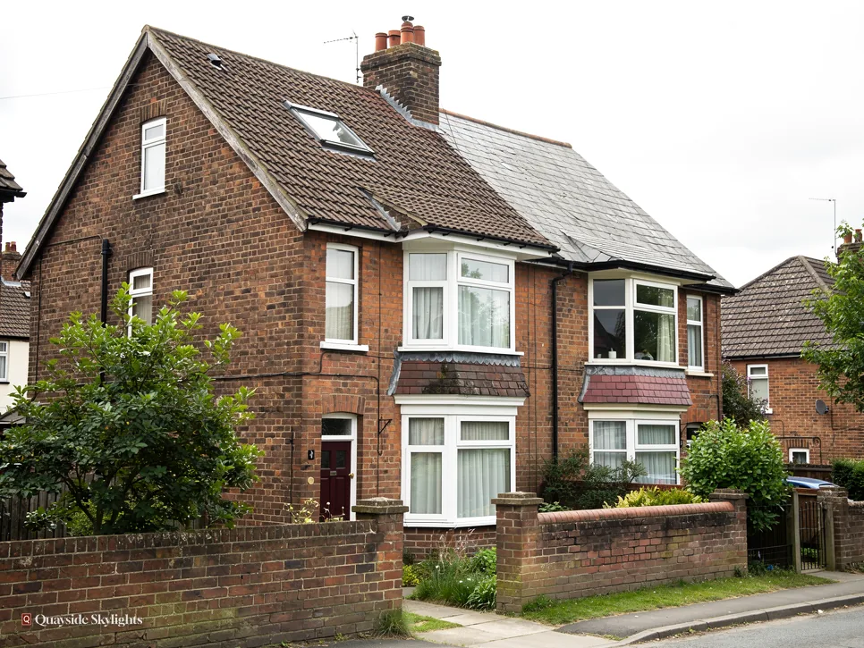 Brick semi-detached houses with bay windows and front gardens